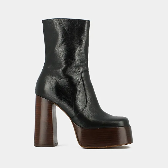 Platform boots with round toes in black aged leather