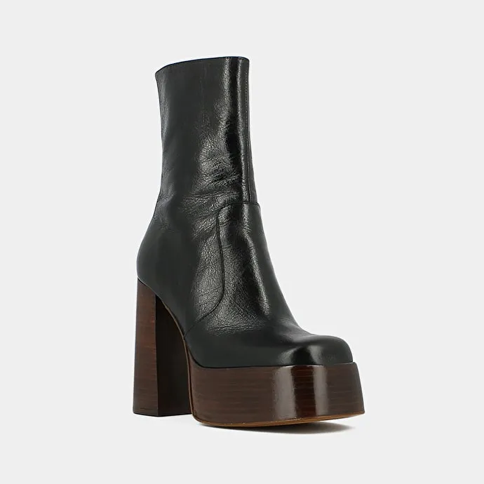 Platform boots with round toes in black aged leather